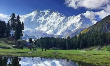 Reflection of mountain in lake at Fairy Meadows