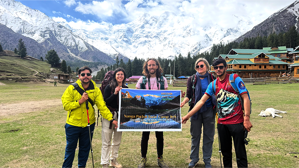 Fairy meadows with lush green grass and surrounded by Nanaga Parbat