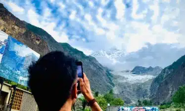 trekker taking pic of rakaposhi-base-camp-trek