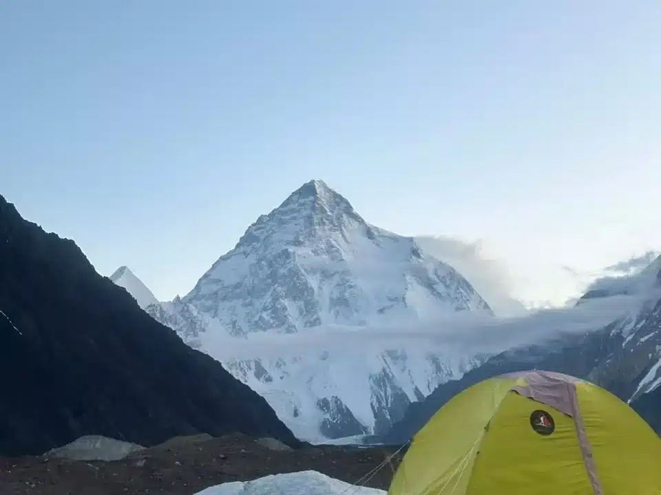 Skardu Trekkers expedition camp at Concordia with the majestic K2 behind.