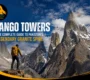 Trango Towers in Pakistan’s Karakoram with a trekker overlooking the dramatic granite peaks